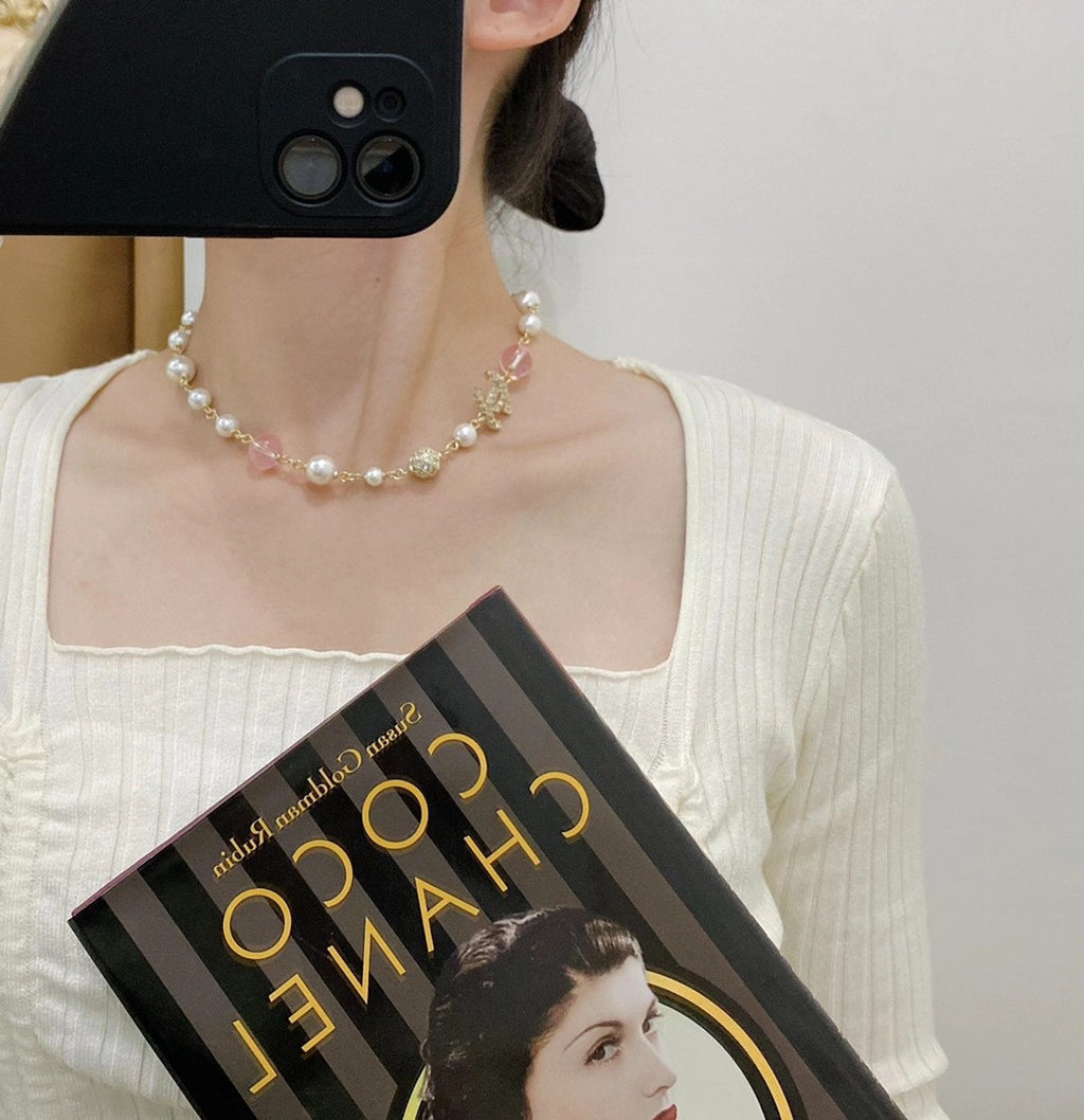 Pearl neck chain necklace.