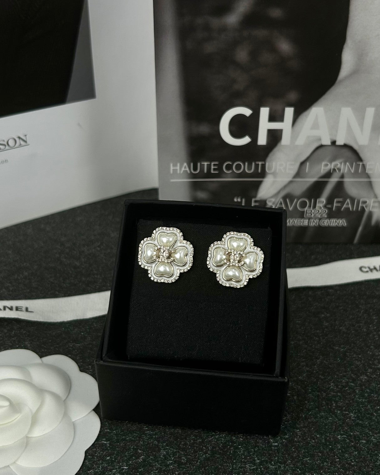 Diamond-encrusted ear studs.