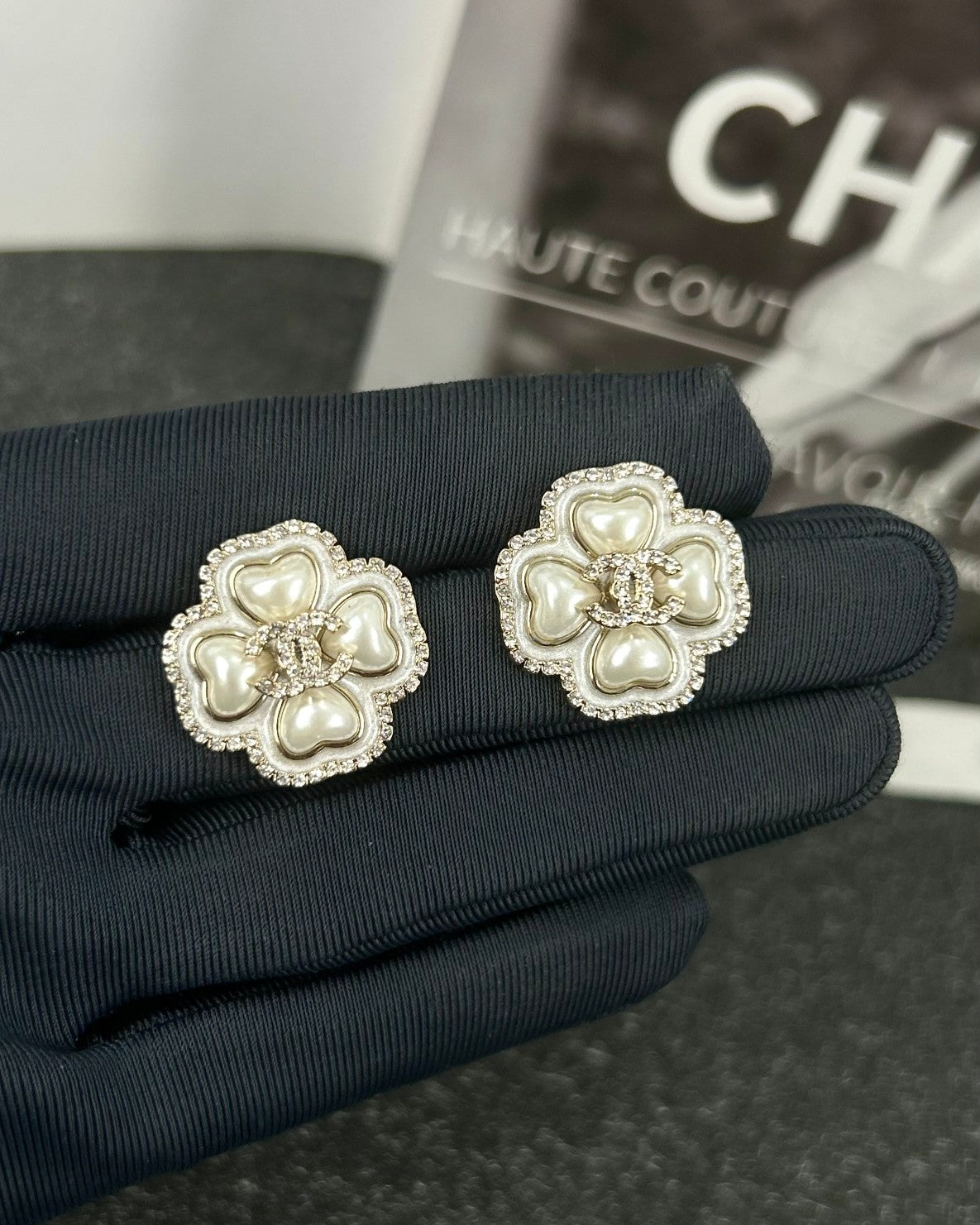 Diamond-encrusted ear studs.