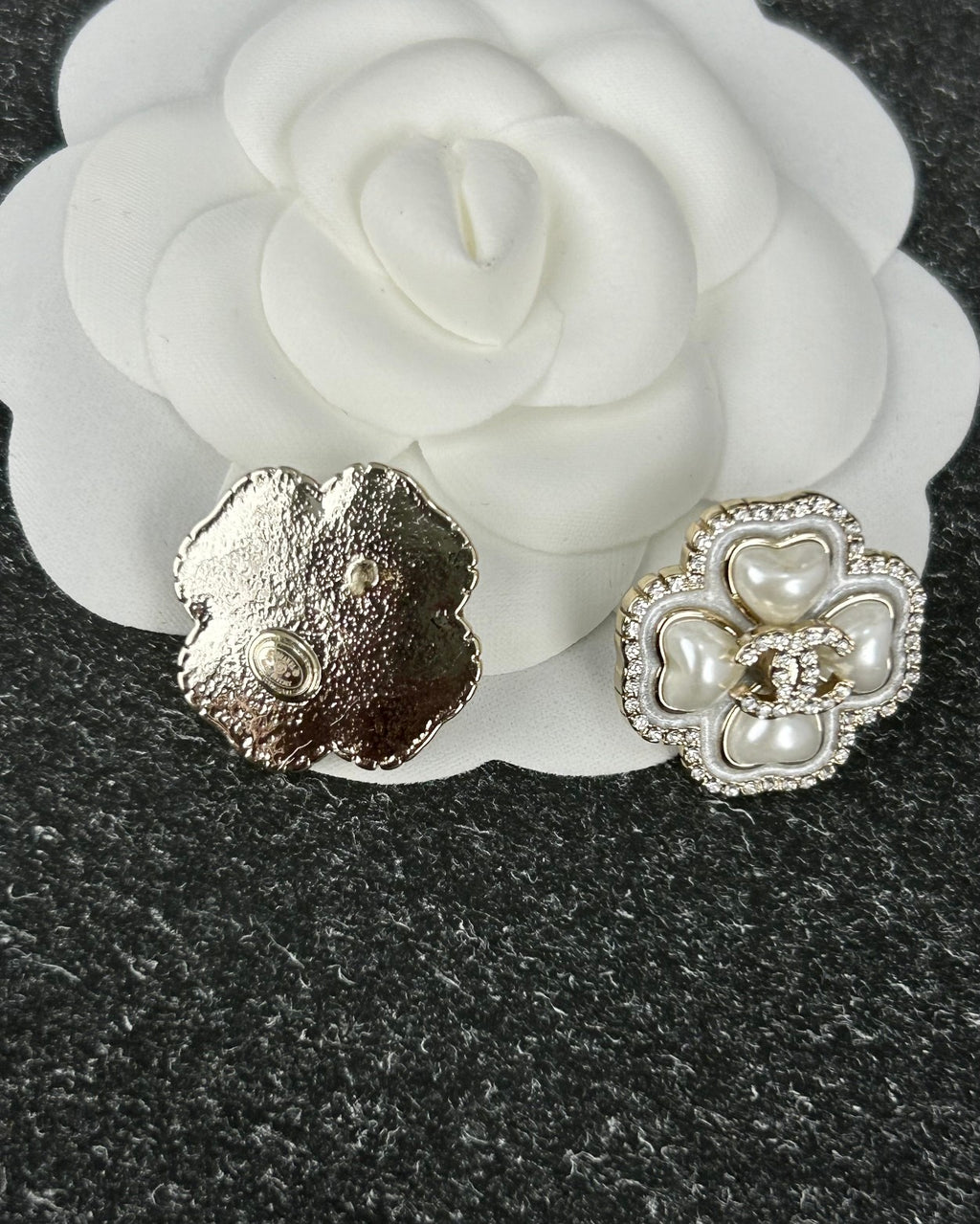 Diamond-encrusted ear studs.