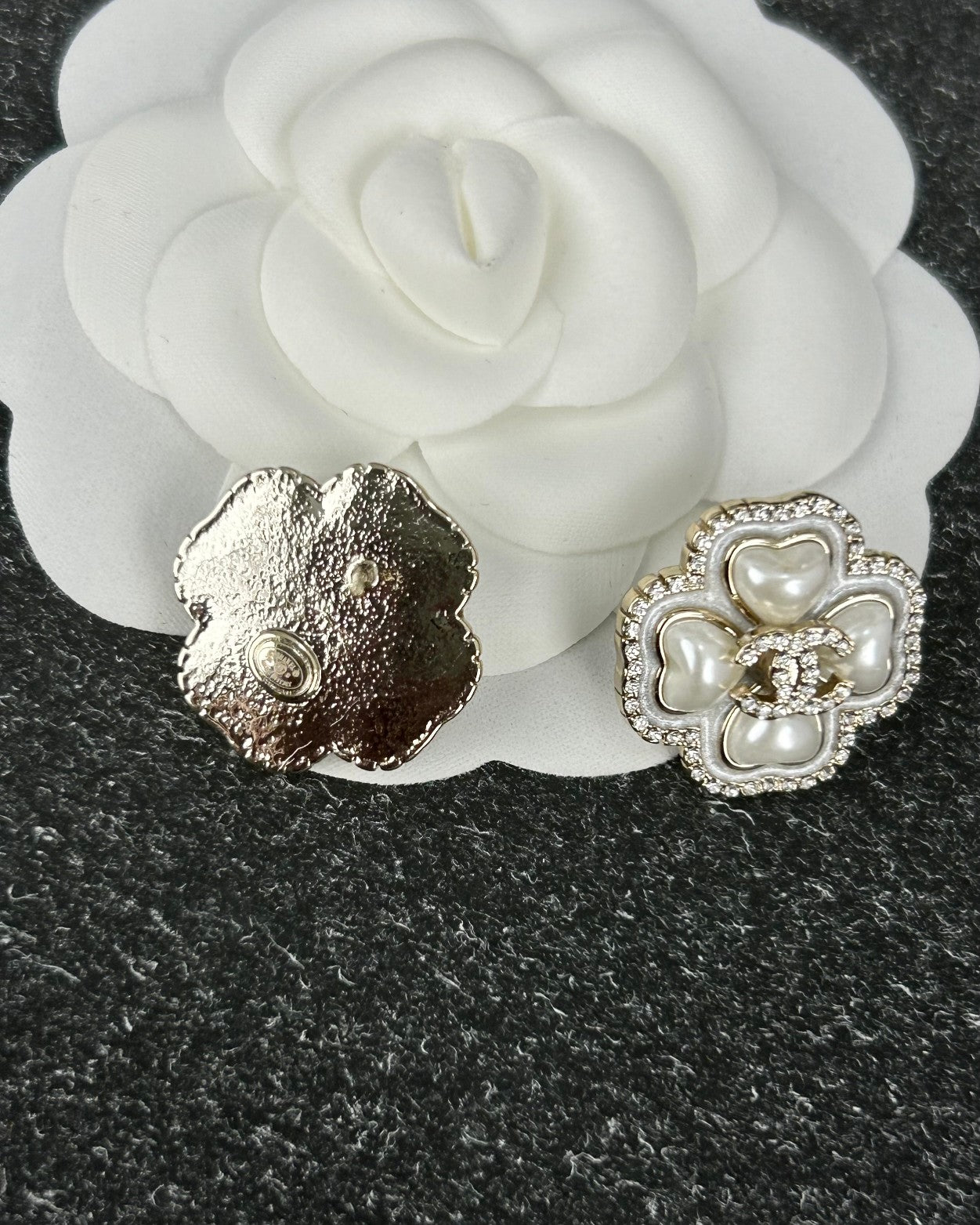 Diamond-encrusted ear studs.