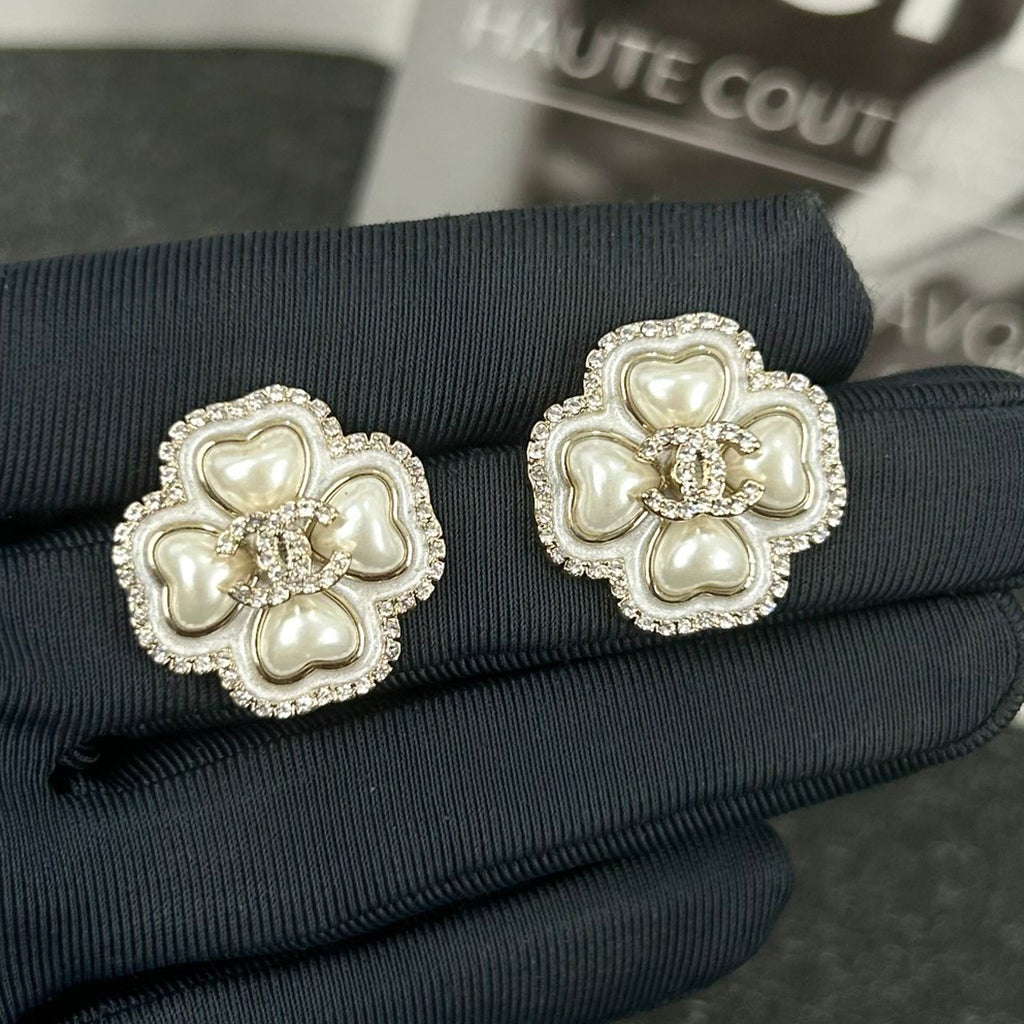 Diamond-encrusted ear studs.